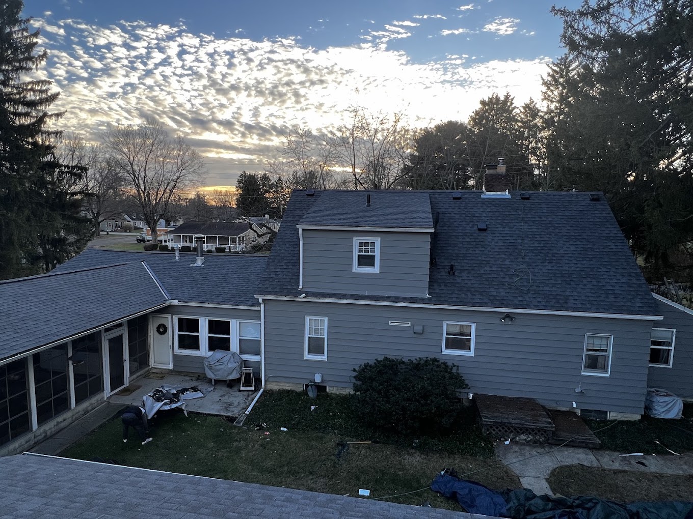 Emergency tarp secured over storm damaged roof section on an Ohio home