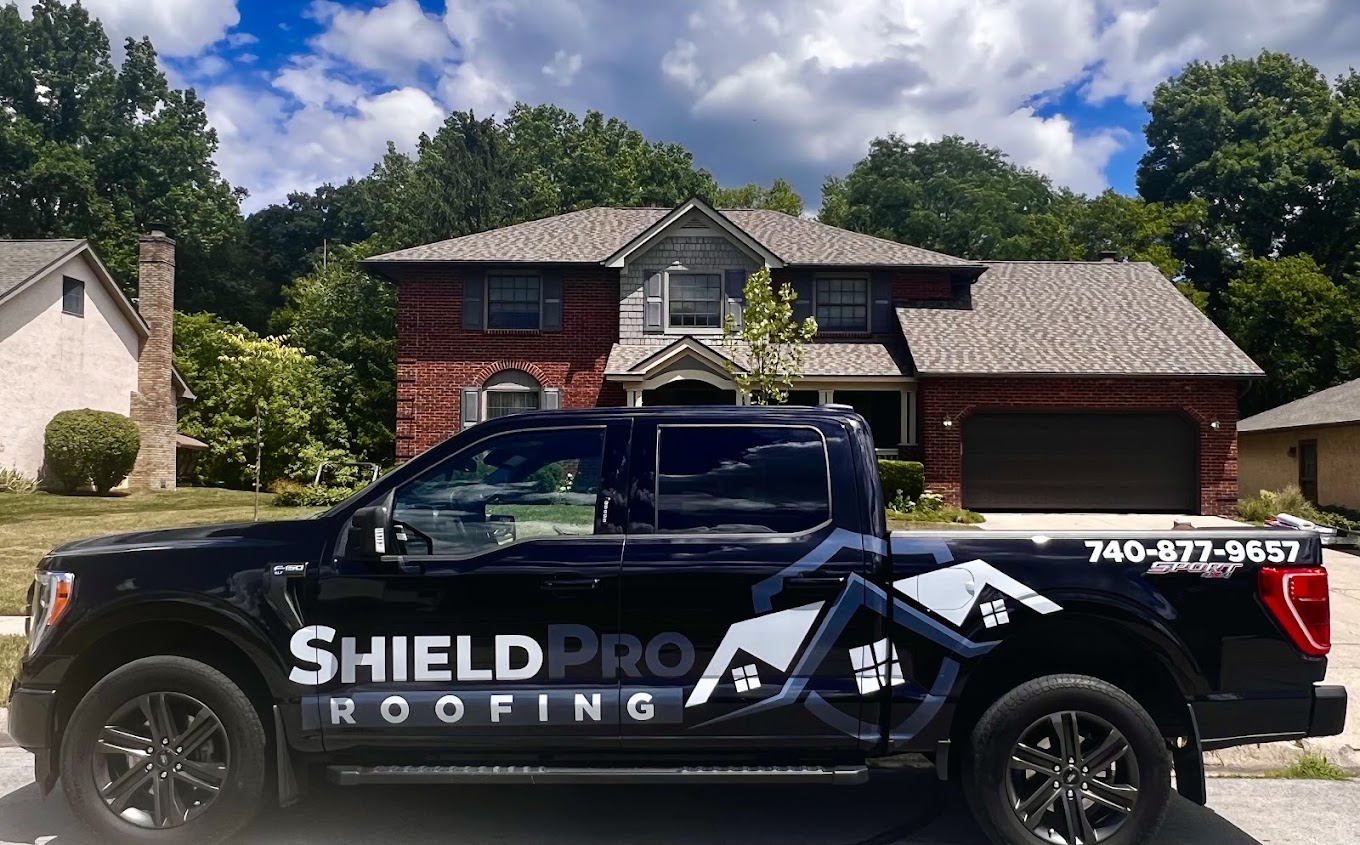 Shield Pro Roofing truck parked outside a Newark, Ohio home