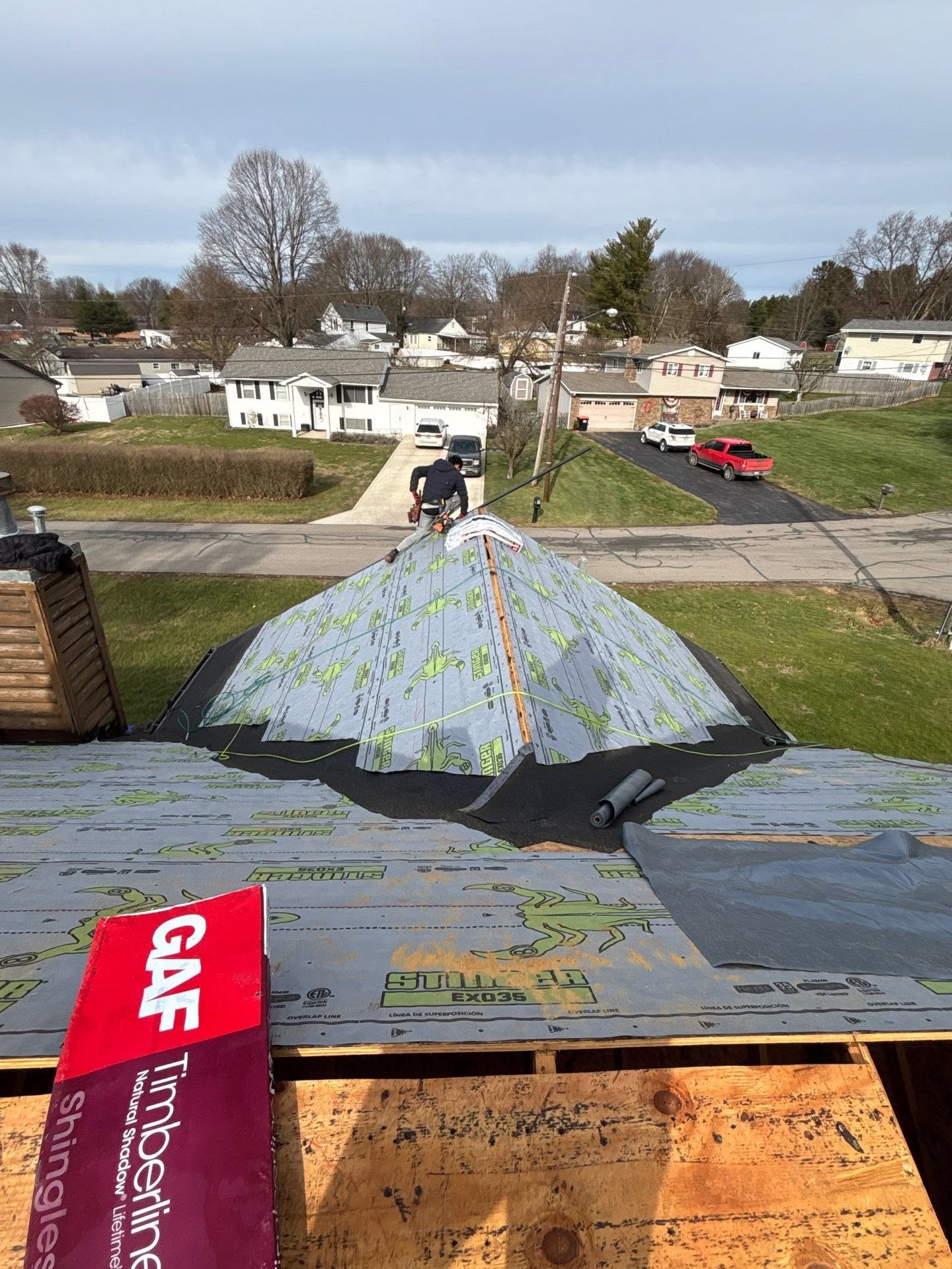 Close up of hail damage bruising on an asphalt shingle marked with chalk