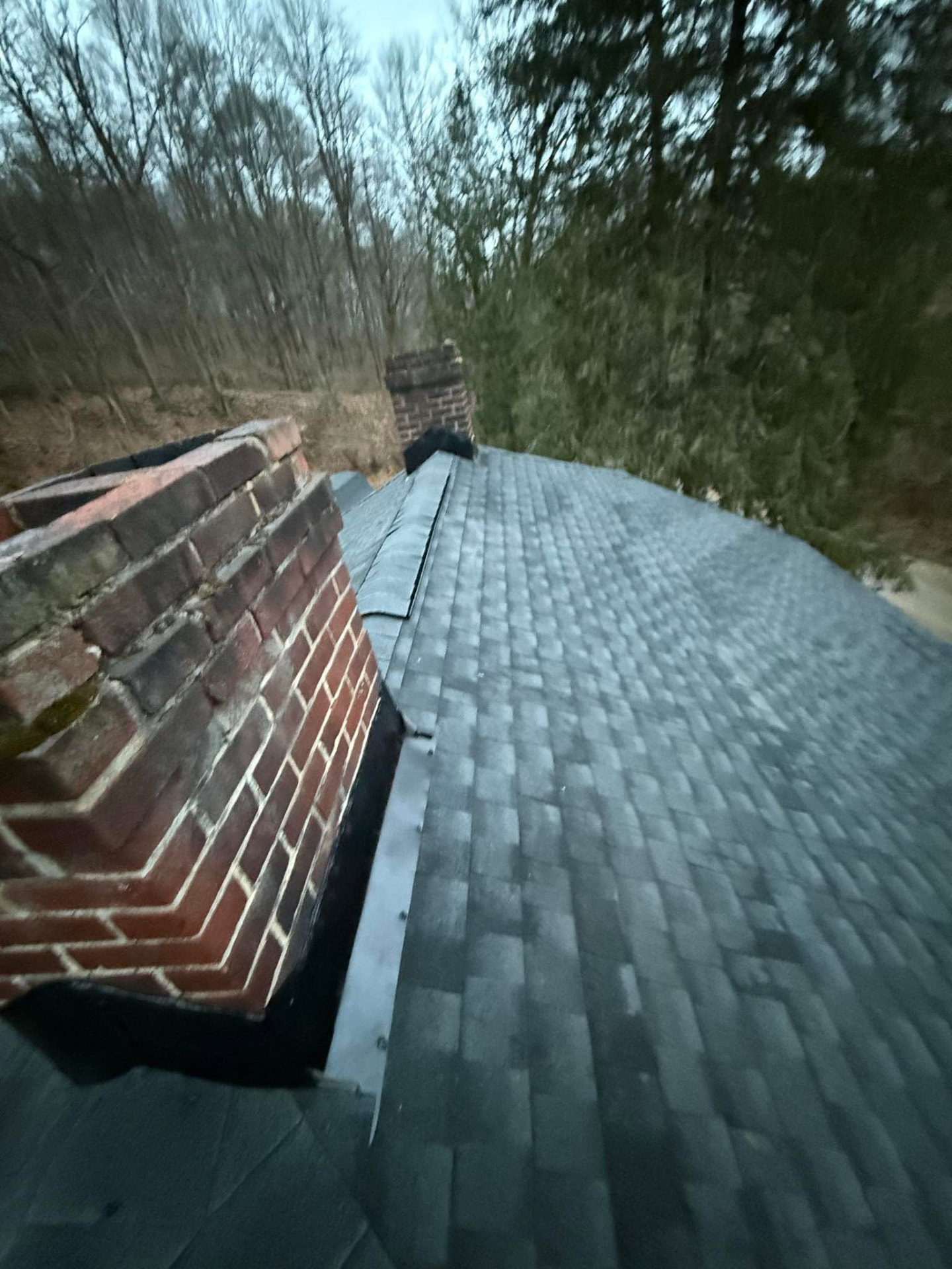 Shield Pro Roofing rep meeting an insurance adjuster on a damaged roof in Licking County